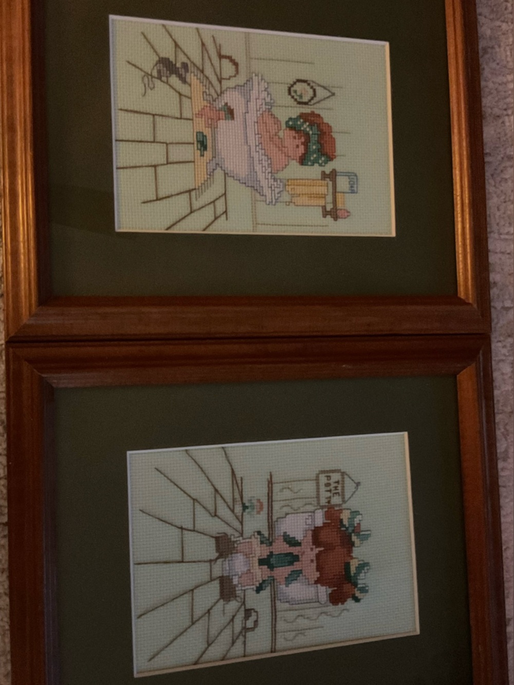 2 vintage 1980s framed Crosstitch
embroidery titled “ Girl Tubby & The Potty”